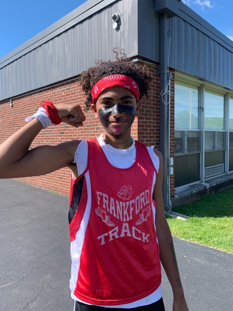 student showing off his arm