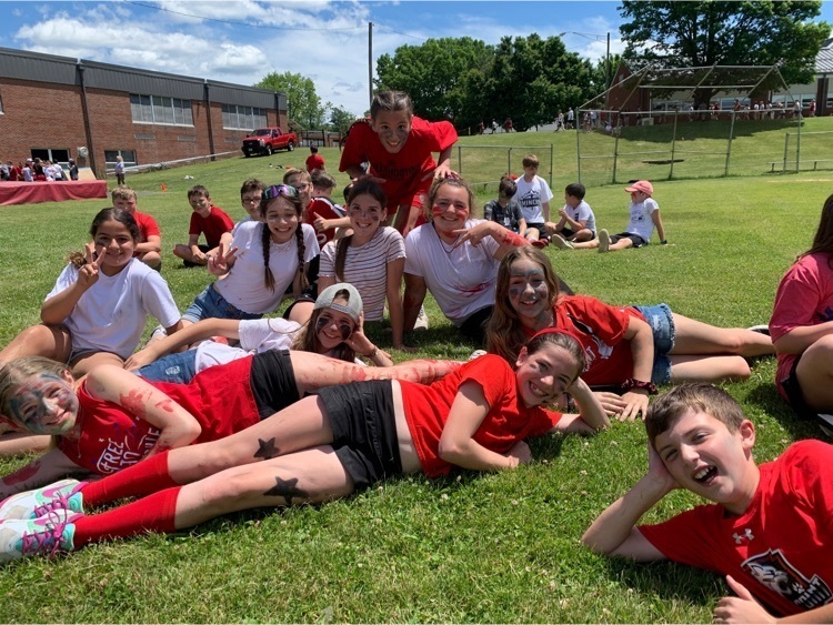 group of students lying in field