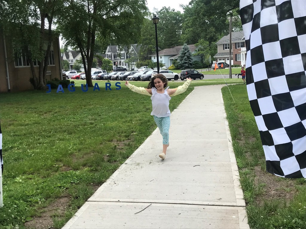 Jefferson student smiles as she nears finish line of Jaguar Jog