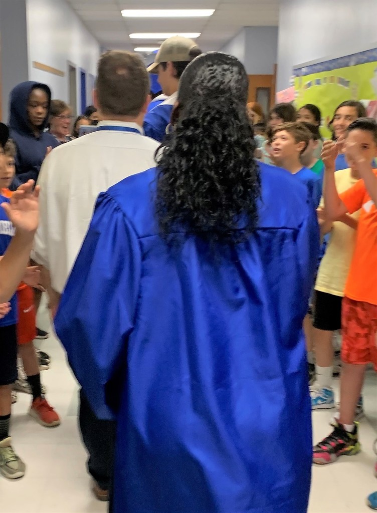 WHS seniors return to elementary alma maters for traditional clap out.