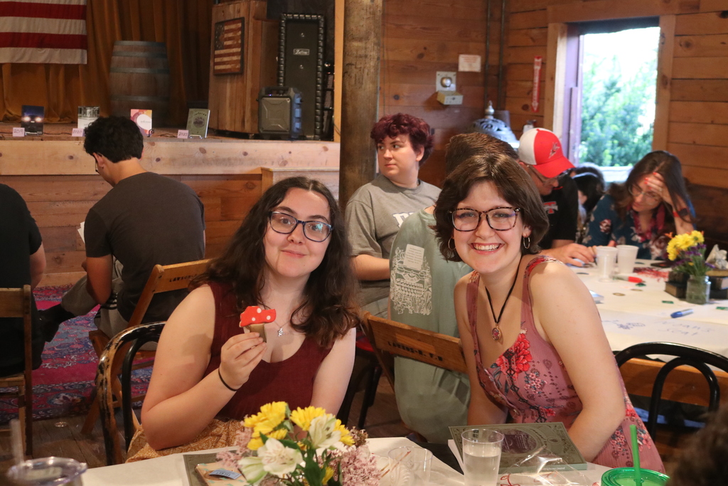 Two students enjoy a snack and friendship.