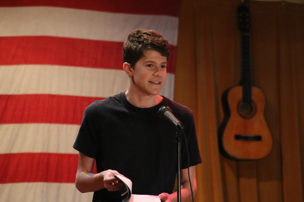 A THS students reads his work from the Inferno.