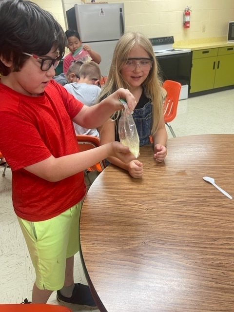 Two students work on their science experiment at Summer School.