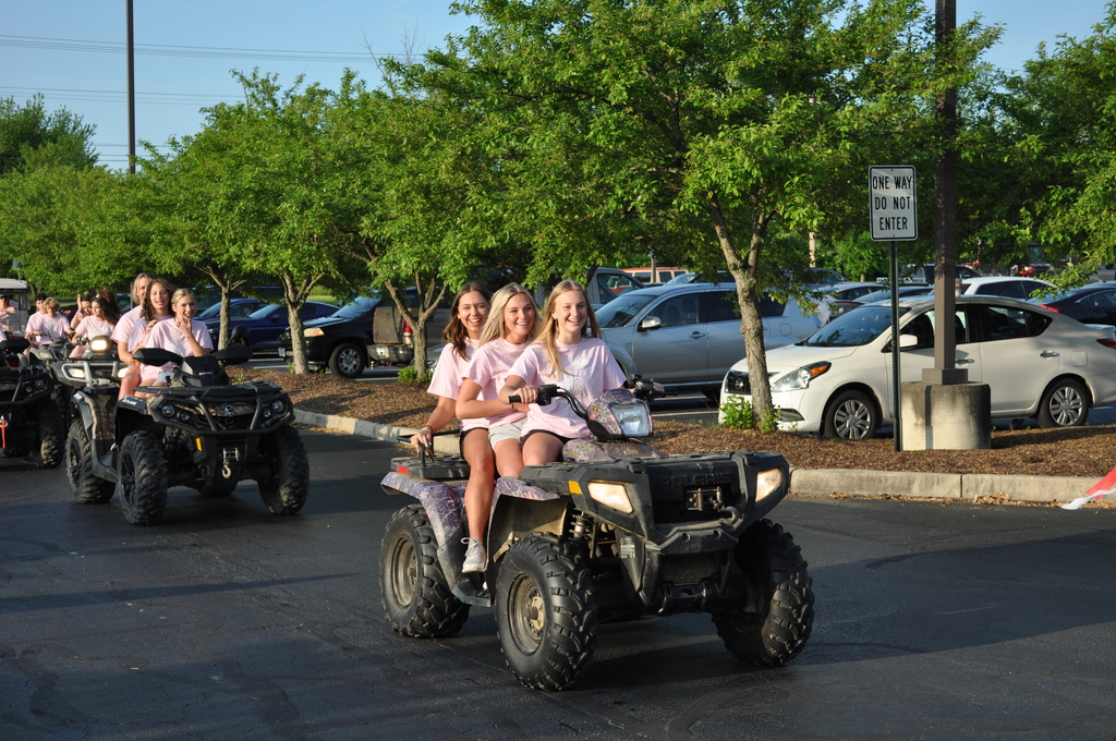 girls on ATV going to school. 