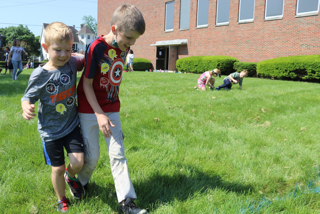 Two boys play a game at Broadway's field day.