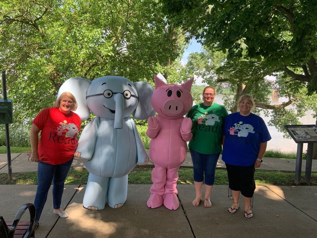 Child nutrition team next to elephant and piggie. 