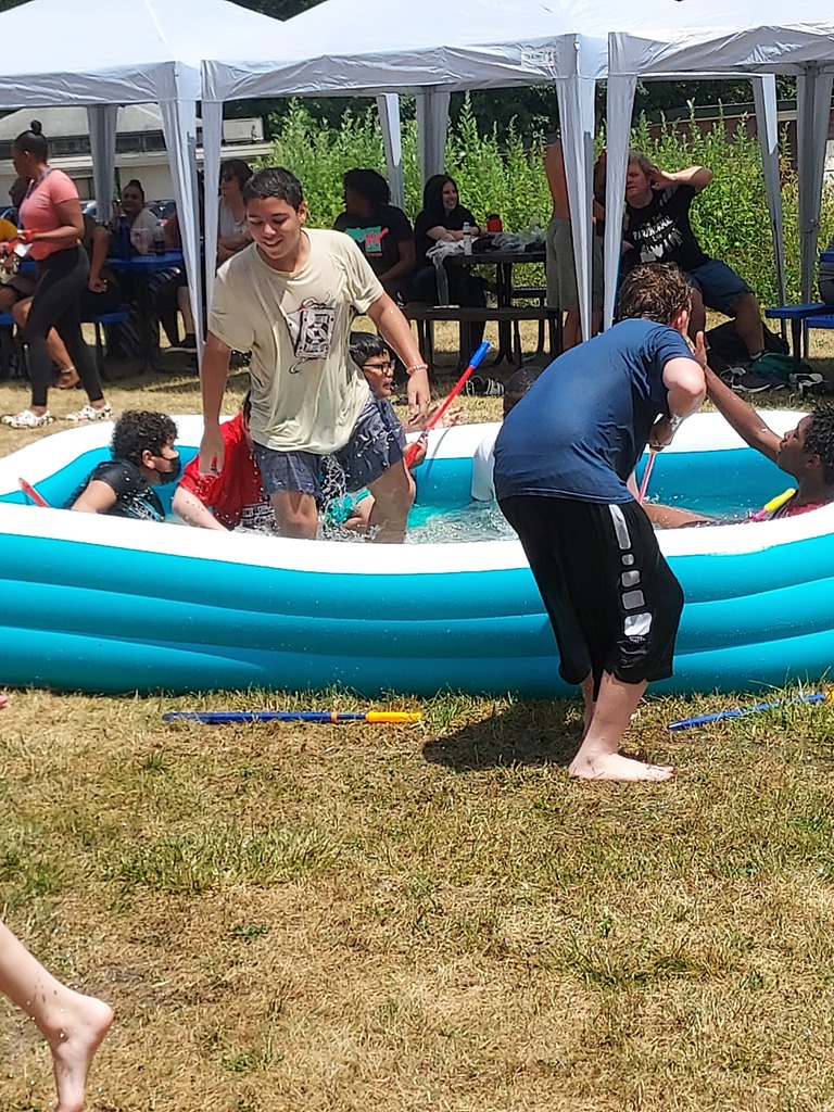 students playing in blue pool