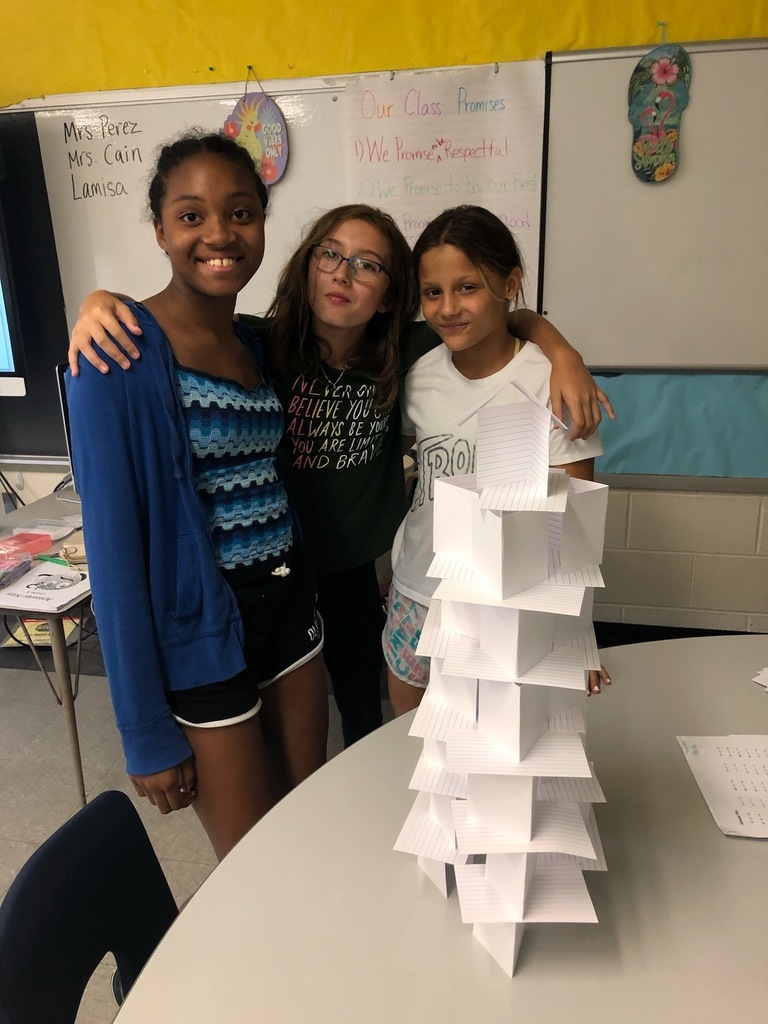 students building index card towers
