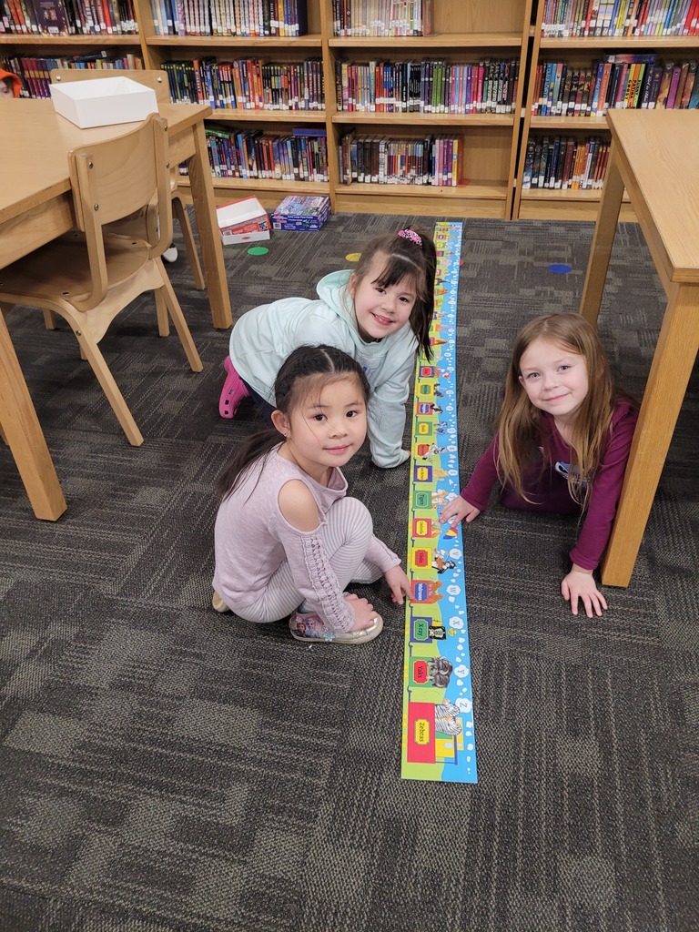 students doing an activity on the carpet