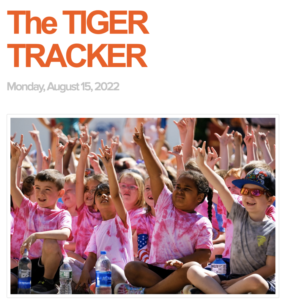 children raising hands