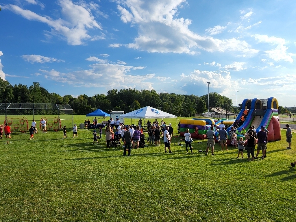 canopies, a target toss, and bounce house