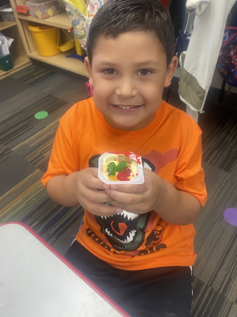 boy holding pudding cup
