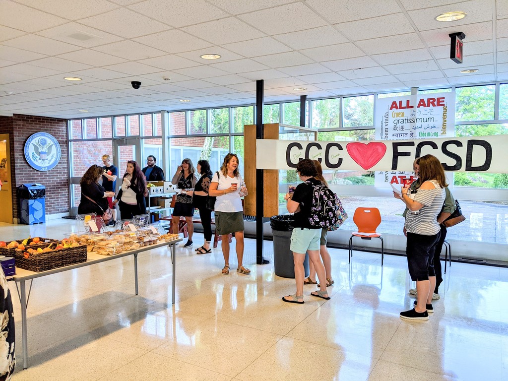 staff mingling in lobby for breakfast