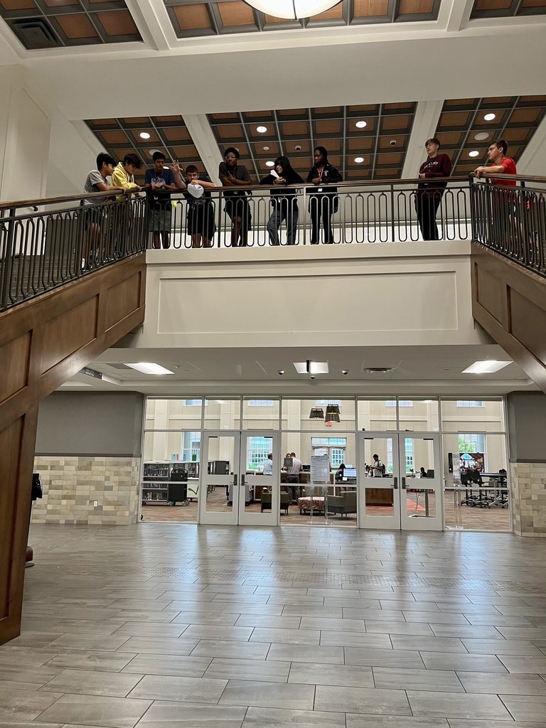 Students in Mr. Ray's class on the second floor of Legacy dropping various items.