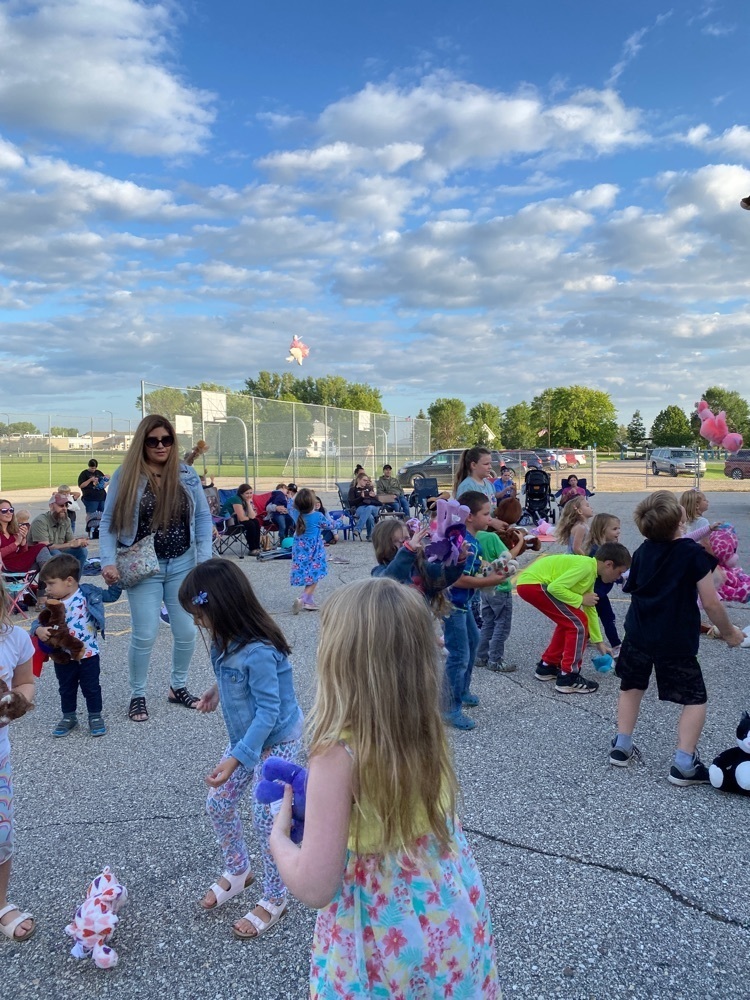 children throwing stuffed animals