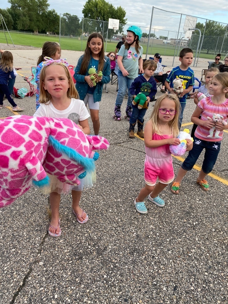 children dancing with their stuffed animal