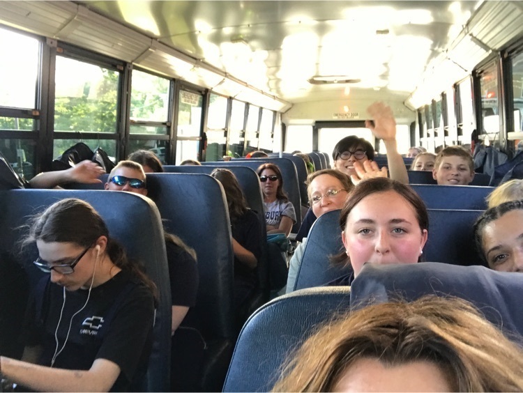 students traveling on a bus