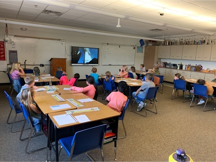 students watching video