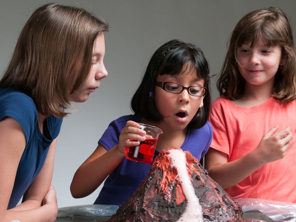 Children building a homemade volcano