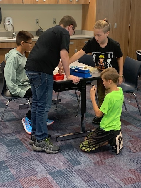 4 students at a table