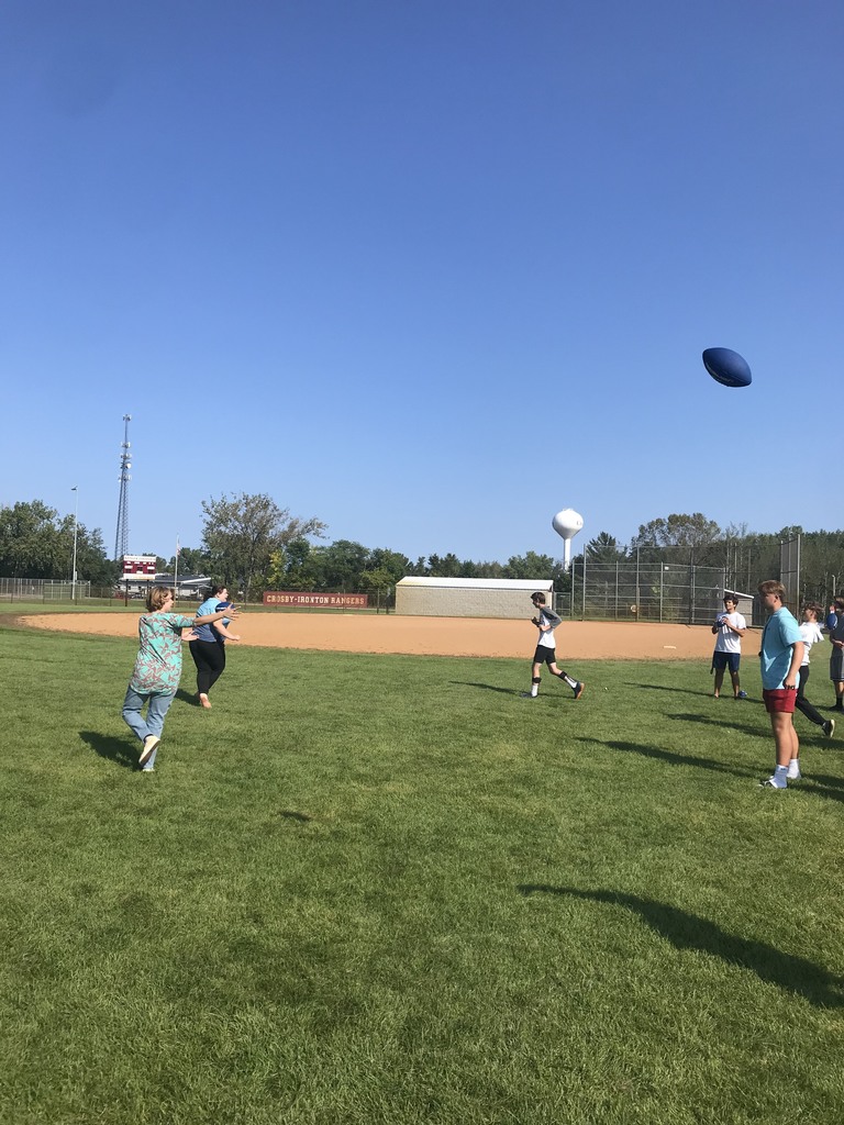 students playing football