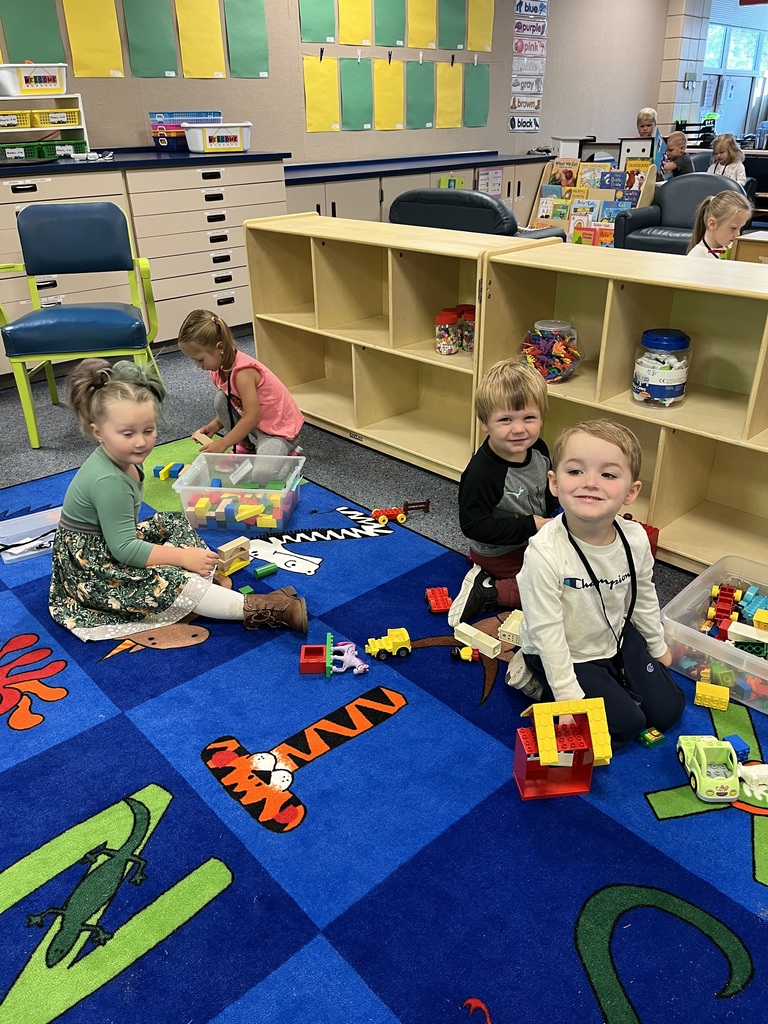 prek students sitting on floor