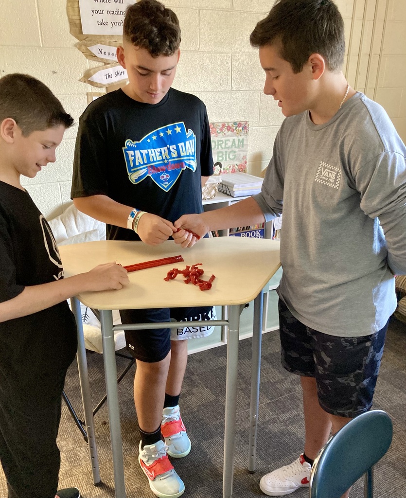 7th and 8th graders working together to complete a challenge!