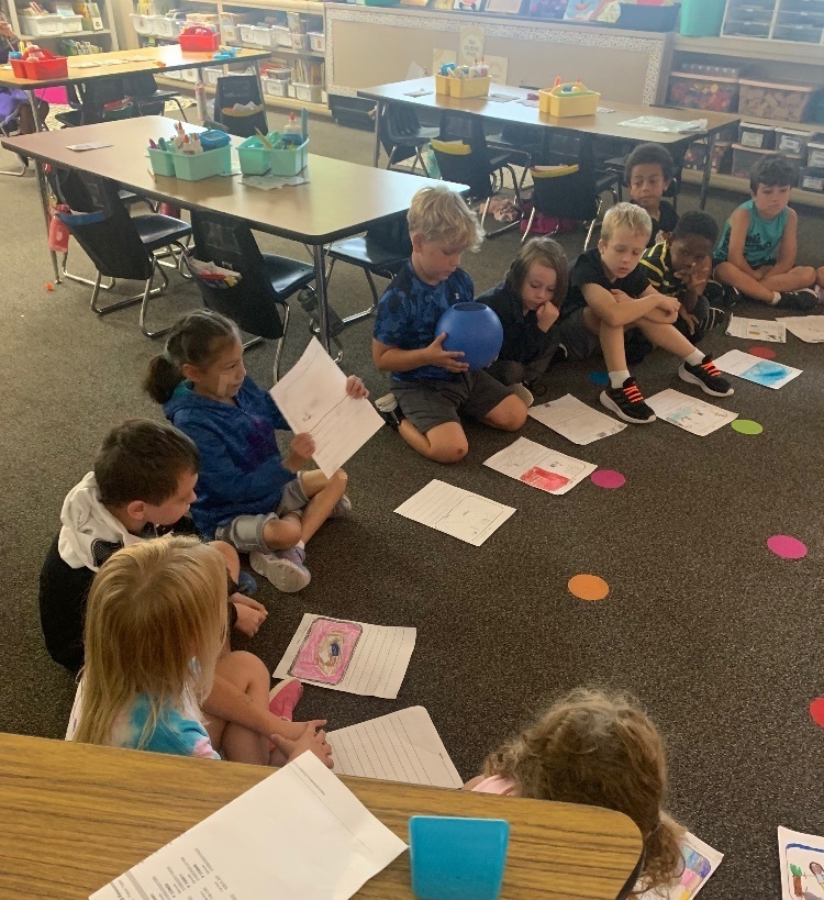 students sharing in a circle