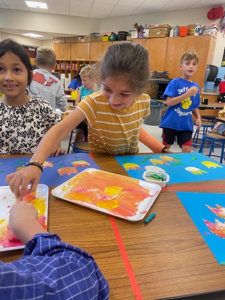 Students doing tulip print making.