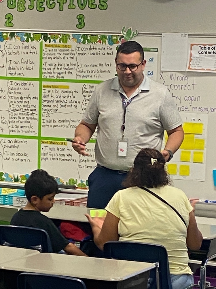 student and parents at open house