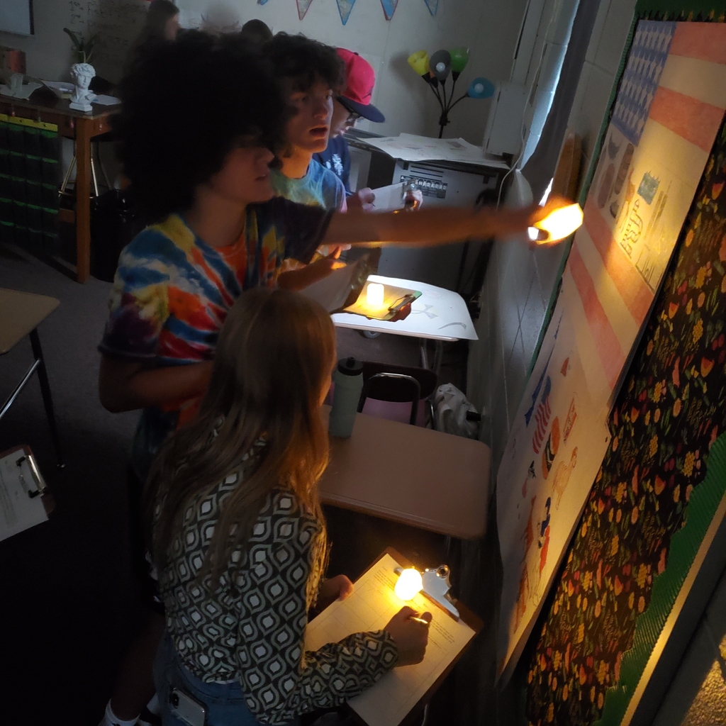 Students exploring cave art