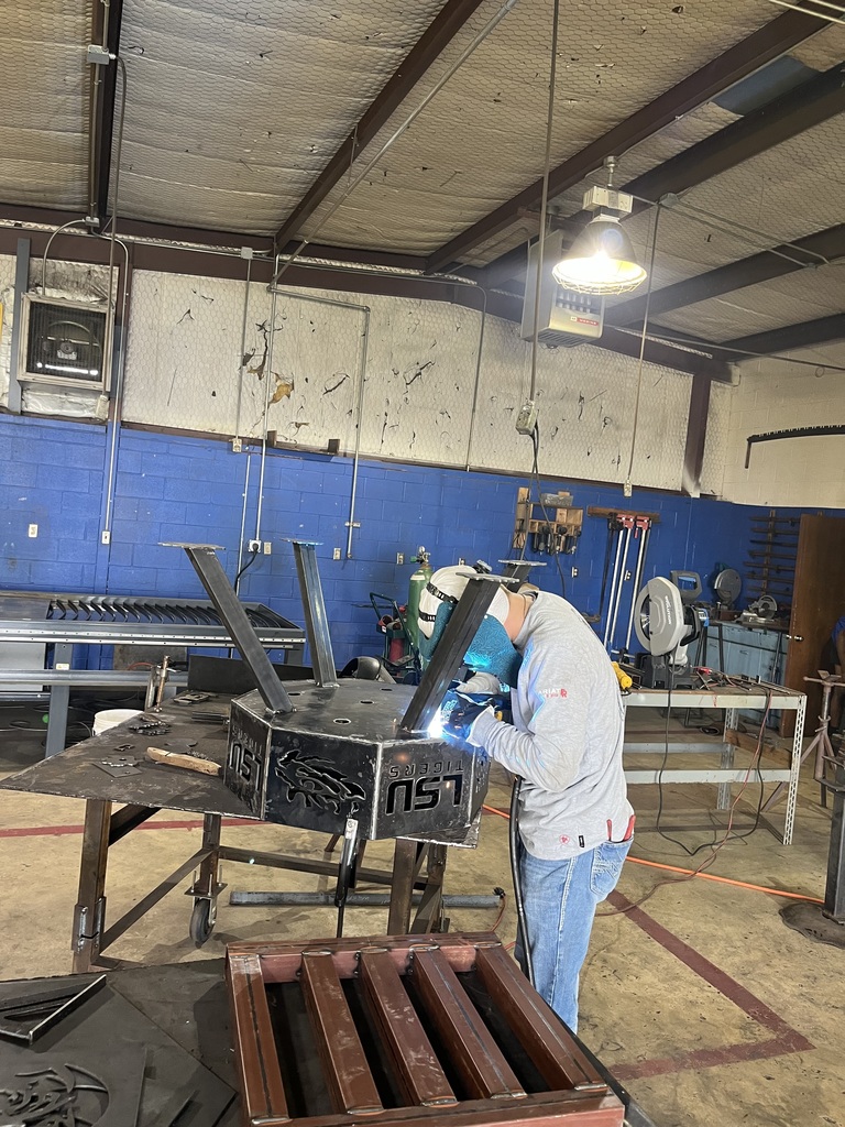 Student Welding a Firepit