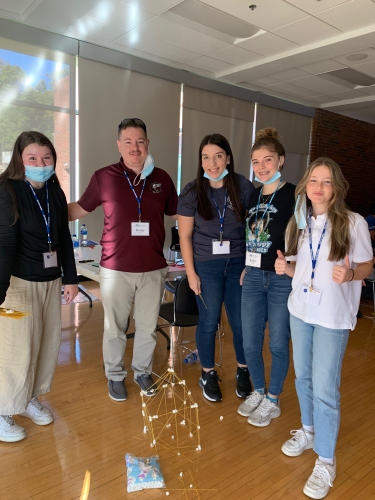 Proud builders of the tallest free-standing spaghetti and marshmallow tower, featuring Jeremy Brewer, Kailey Shouse, and Shelby Murray