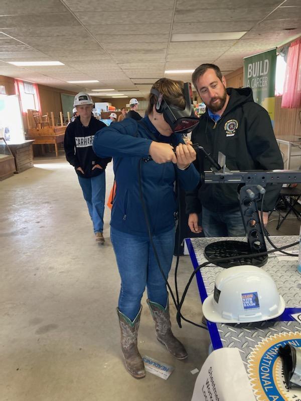 teacher learning to weld