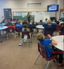 Students listening to a speaker