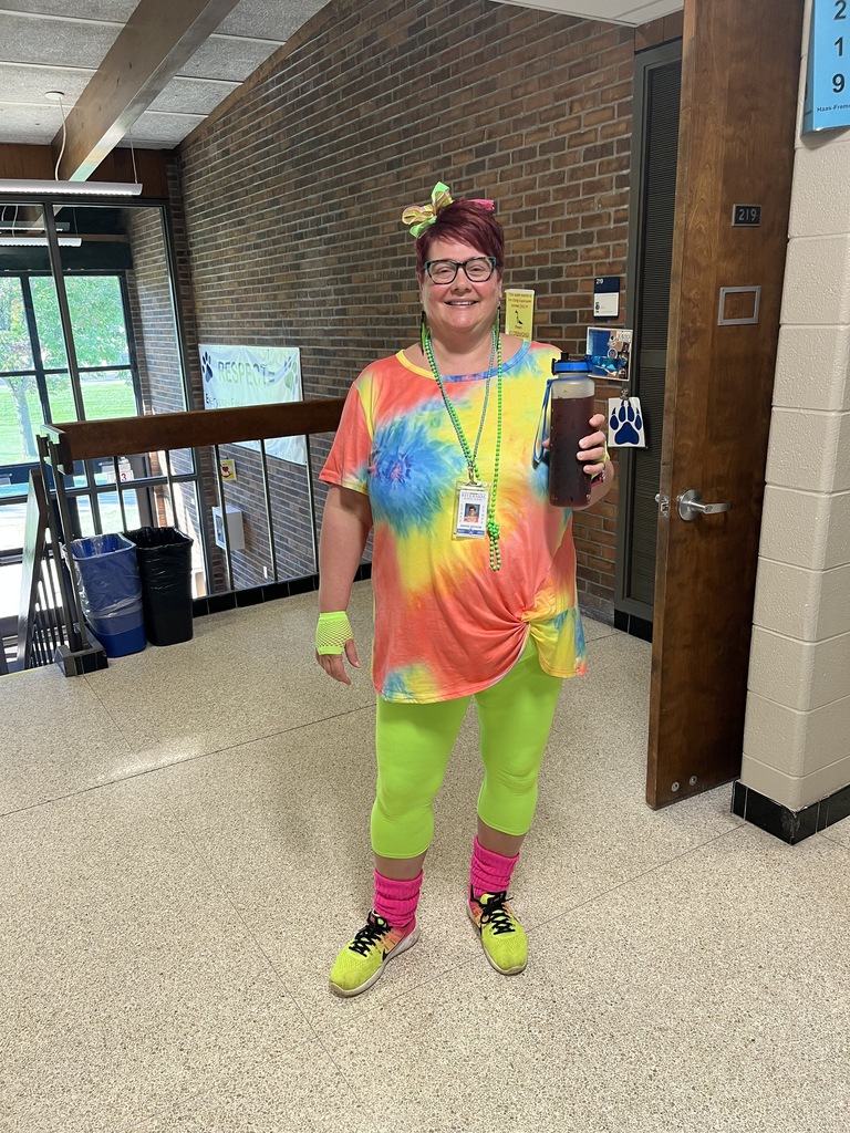 staff dressed in tie dye colors