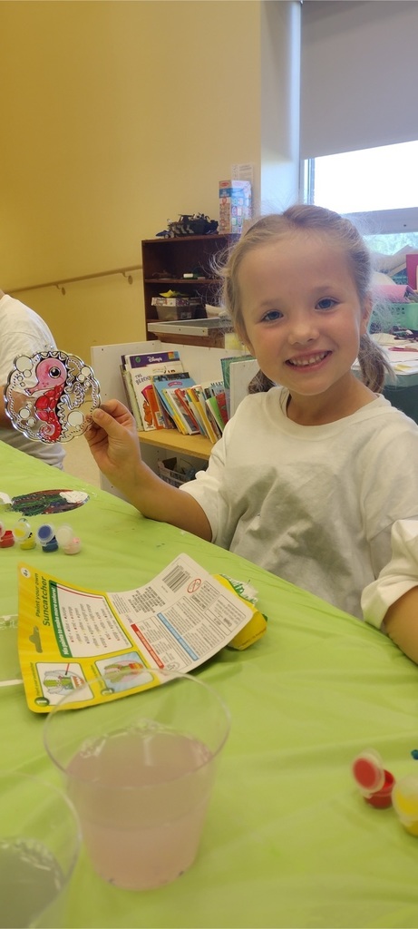 Students at afterschool program paint with watercolors