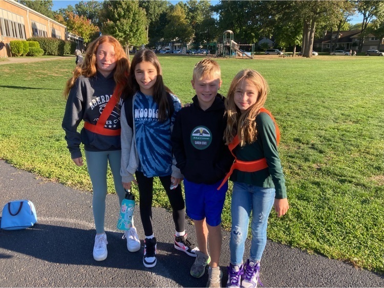 to safety patrols standing with two 4th graders