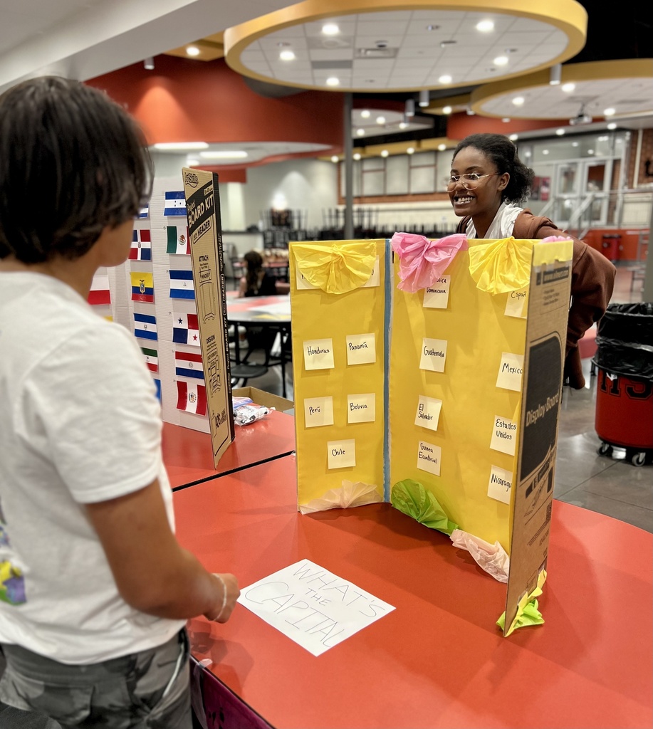 two students talking about a presentation