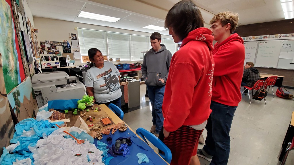 Students showing Ms. Meanus their replica of Celilo Falls