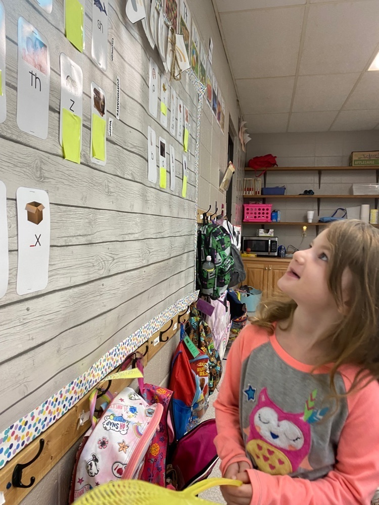 student looking at sound wall