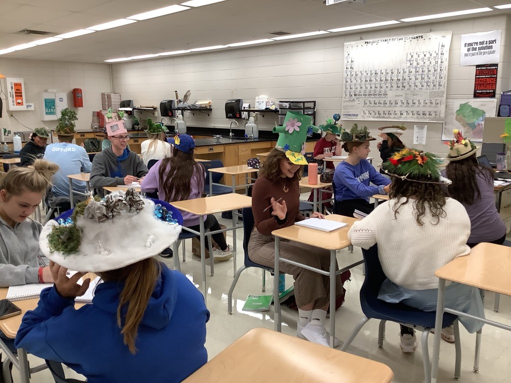Students wearing biome hats