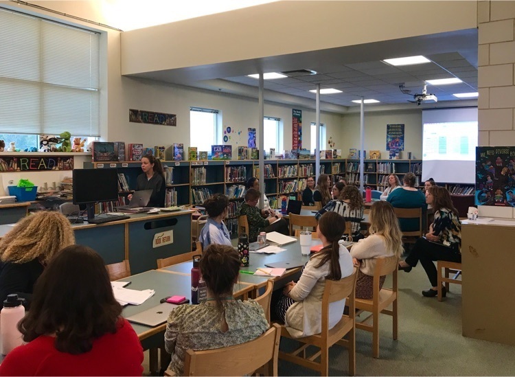 Math Coach Caitlin Daley leads the staff professional development activities during the early real session time.