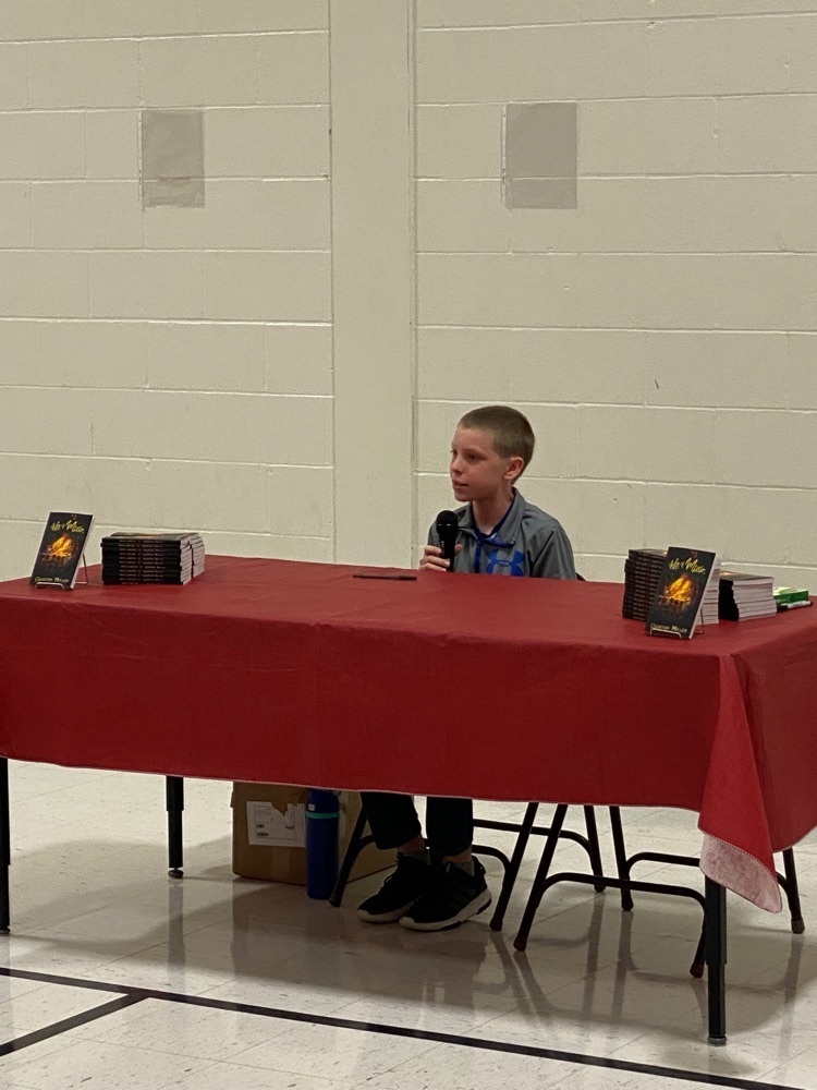 Quinton Miller at his book reveal (at the age of 13) in front of all 3rd - 8th grade students from Highland!