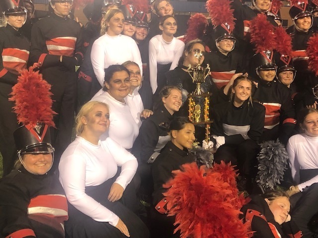band holding trophy 