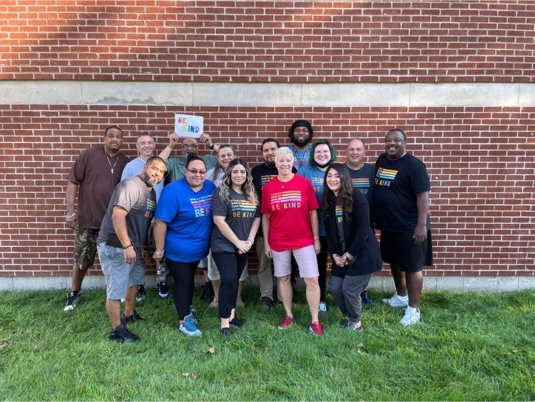 image of staff members in kind shirts 