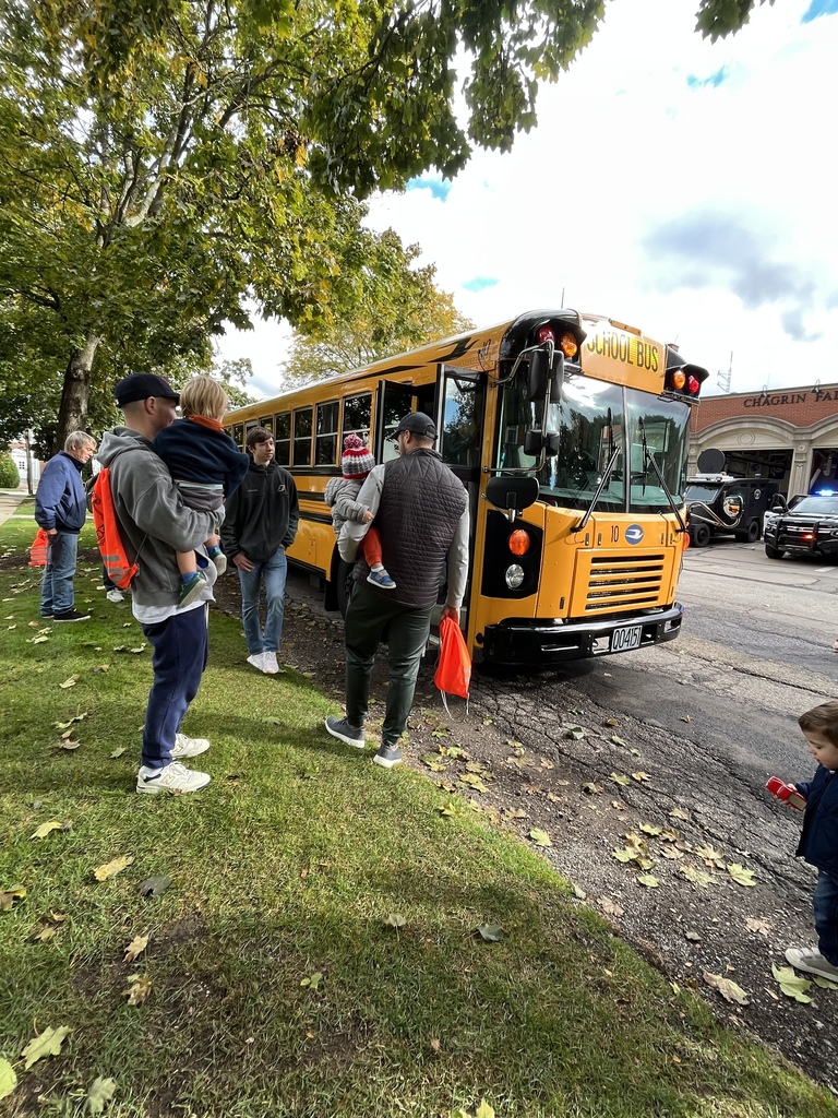 people looking at bus