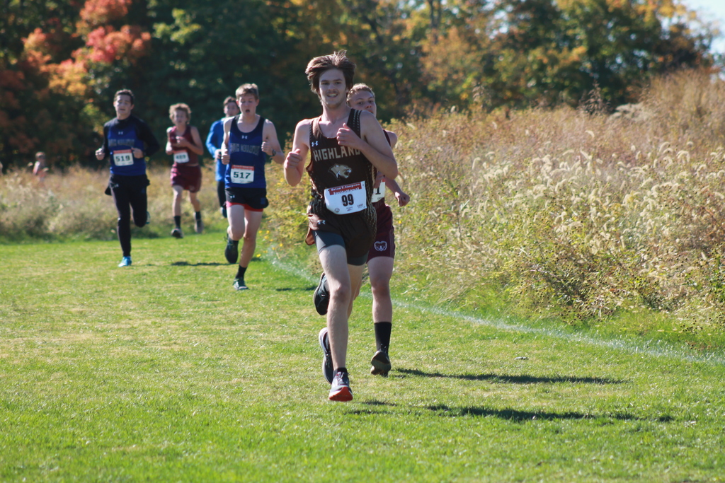 Ethan Clow (21st) passing several runners as he approaches the final stretch of the race at the Brian T. Simpson invitational.