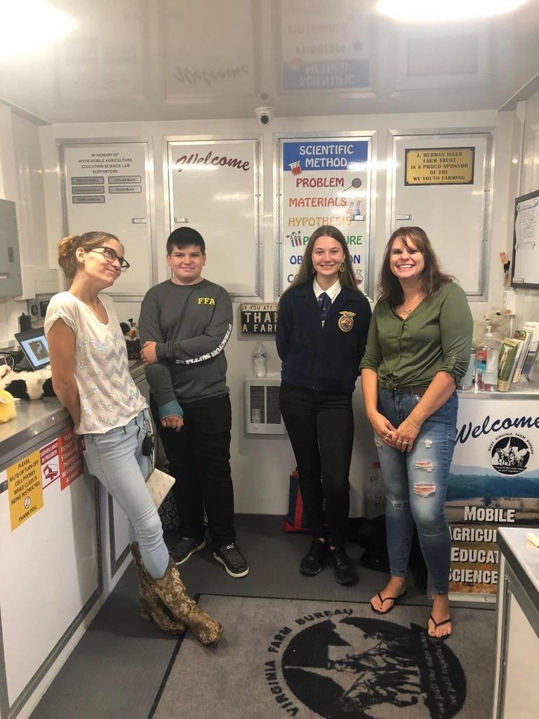 FFA  members helping with   WV Farm Bureau Mobile Agriculture Education Science Lab at Pleasant view