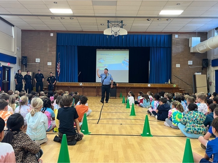 Students listening to Captain Karl at the assembly in the gym. 